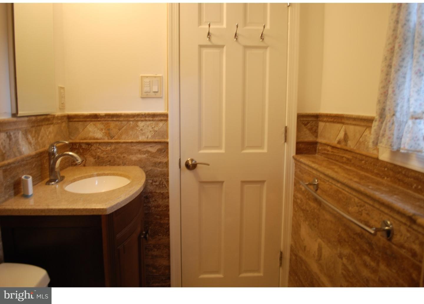 22 Hearthside Road Aston, PA 19014 - Photo 18 of 22 a bathroom with a sink and a mirror