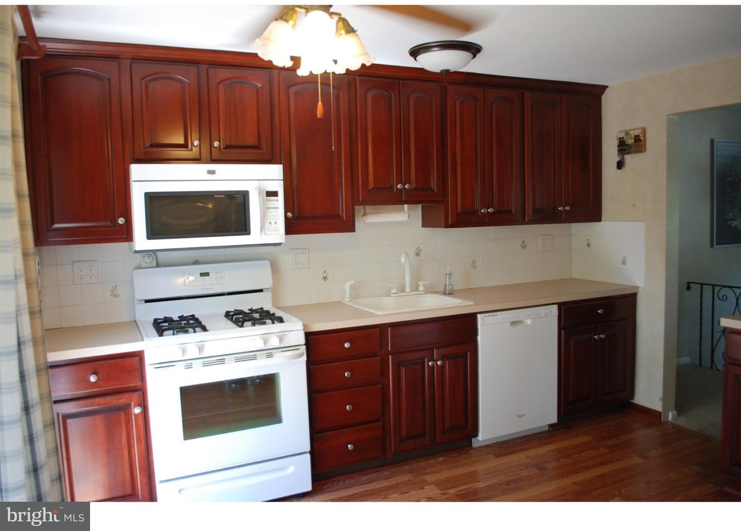 22 Hearthside Road Aston, PA 19014 - Photo 4 of 22 a kitchen with a cabinets and white appliances