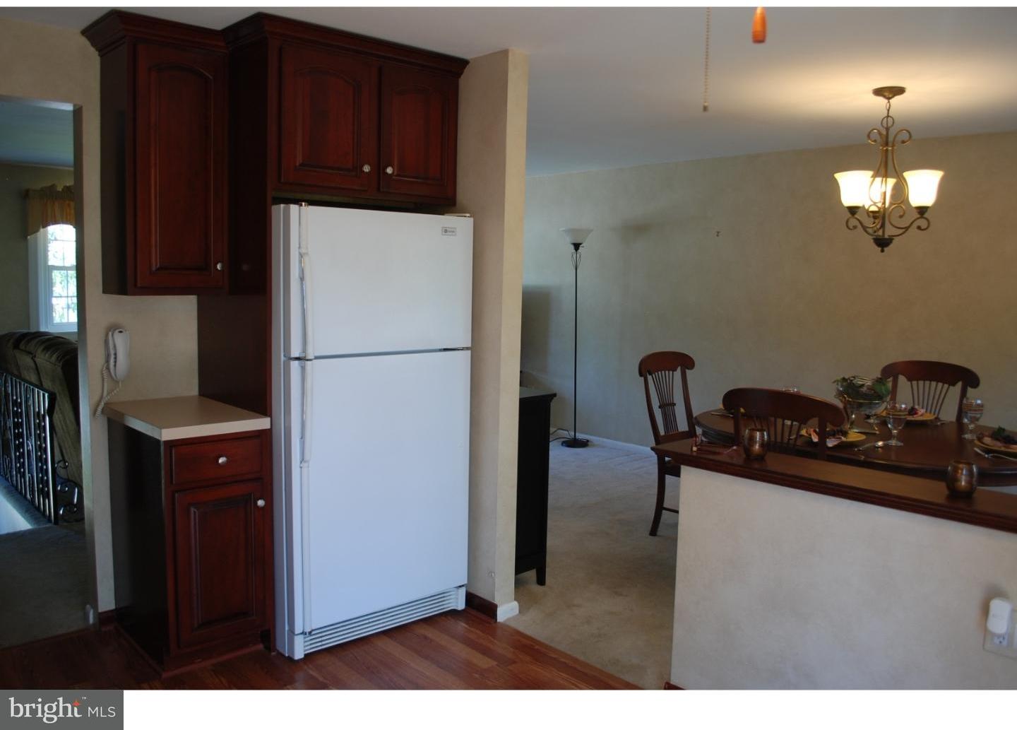 22 Hearthside Road Aston, PA 19014 - Photo 6 of 22 a kitchen with a refrigerator and a stove