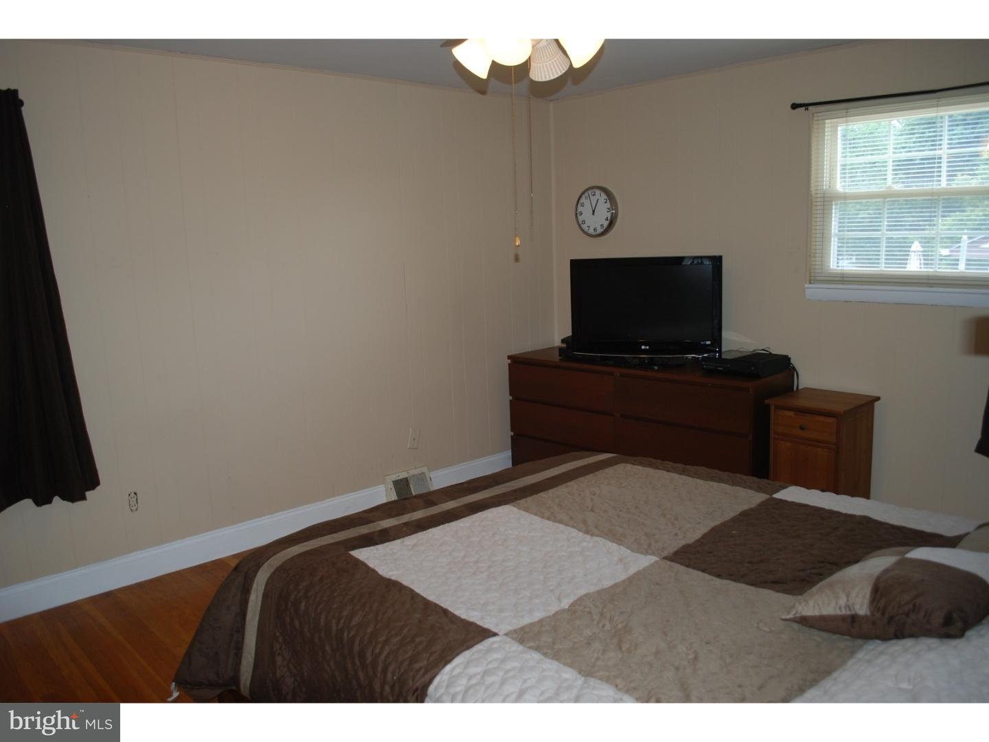22 Hearthside Road Aston, PA 19014 - Photo 10 of 22 a bedroom with a bed and a flat screen tv