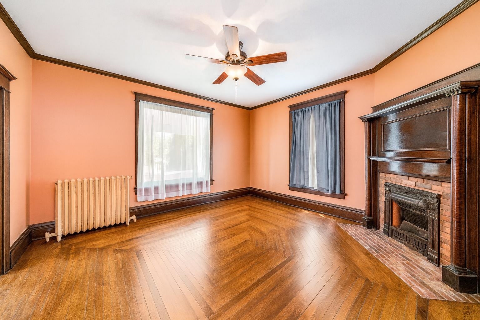 111 South Sycamore Street Genoa, IL 60135 - Photo 21 of 22 a view of an empty room with a window and wooden floor