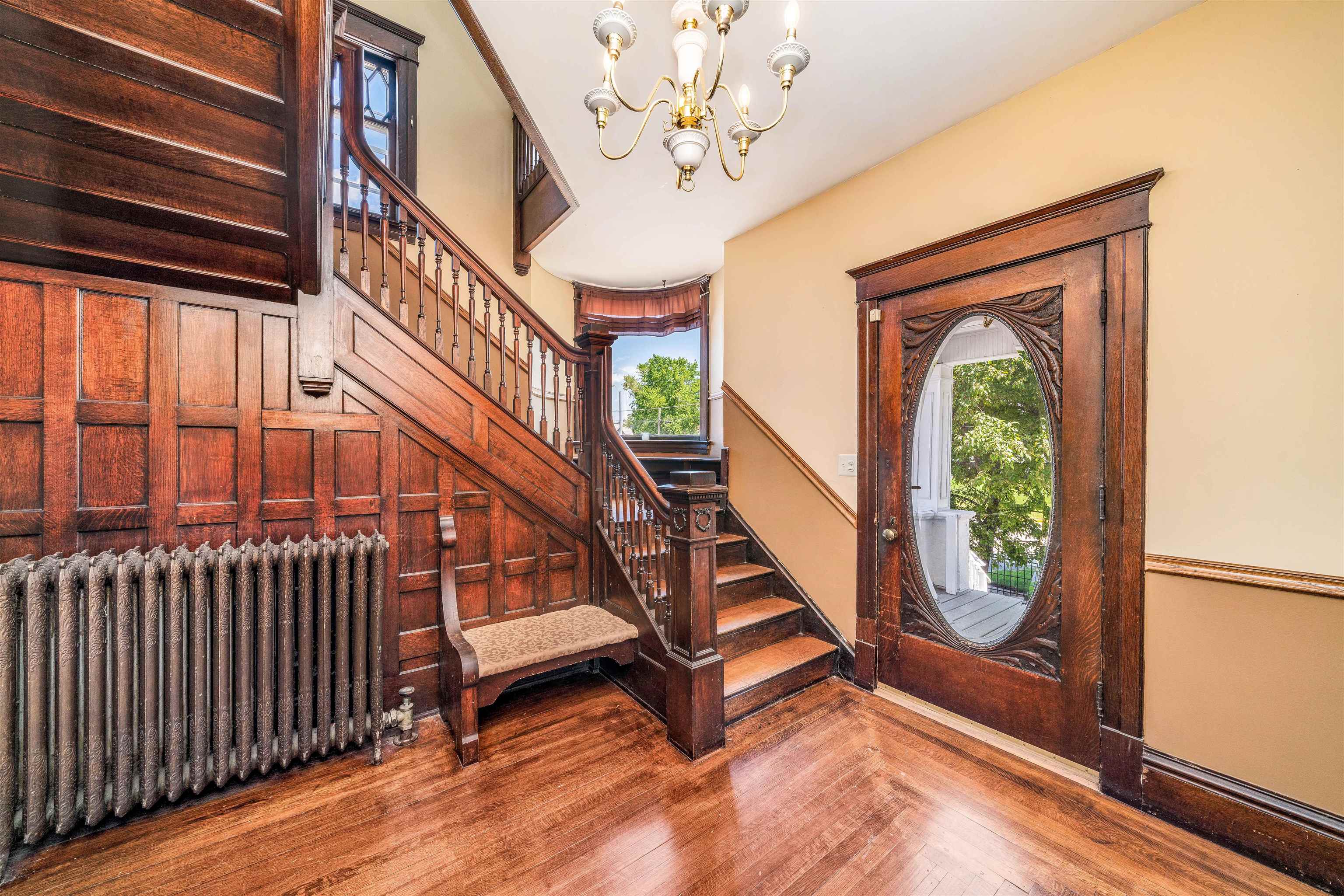 111 South Sycamore Street Genoa, IL 60135 - Photo 9 of 22 a view of entryway with wooden floor and stairs