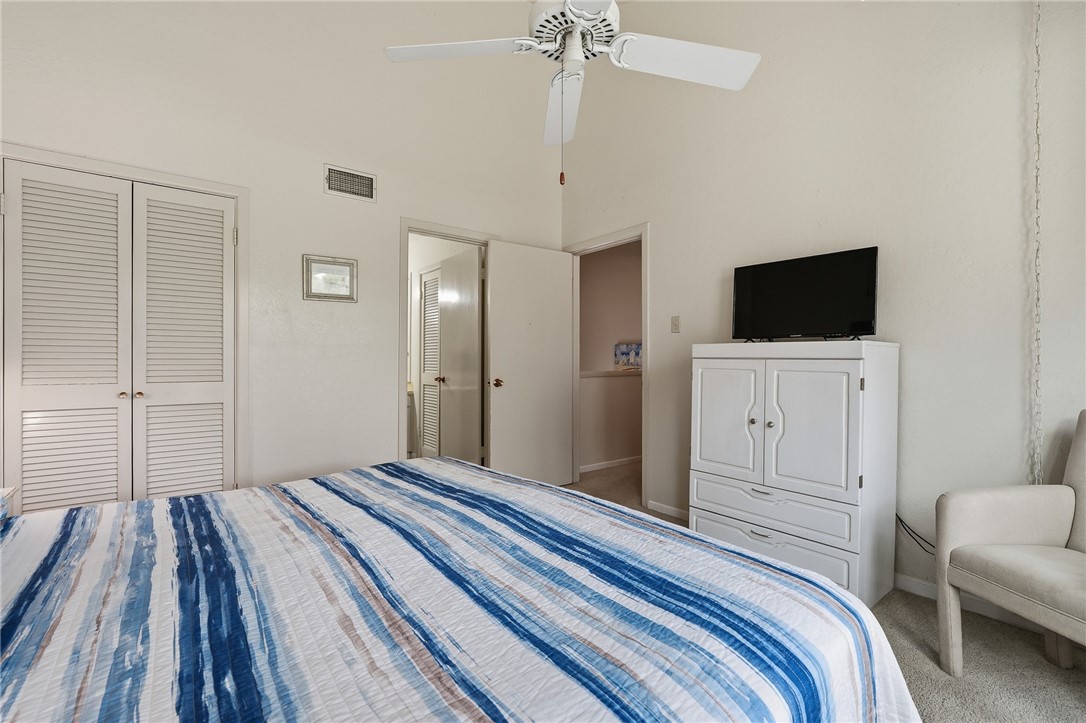 2003 North Fulton Beach Road, Unit 34 34 Rockport, TX 78382 - Photo 19 of 38 a bedroom with a bed and a flat screen tv