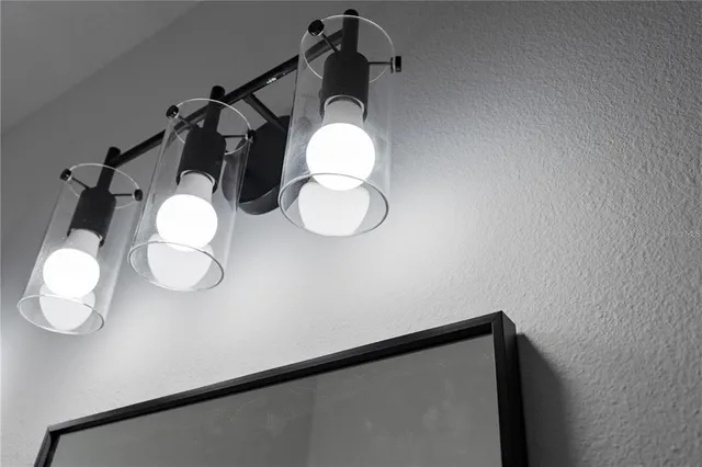 a close view of a faucet a sink and a bathroom with bathtub