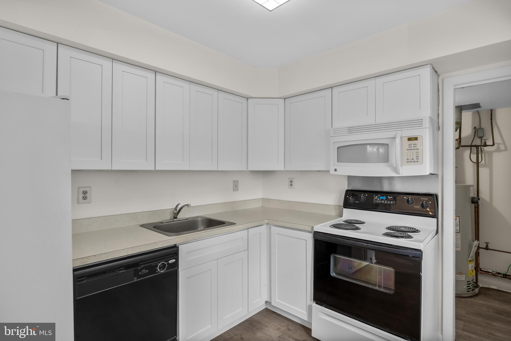 367 Barton Run Boulevard Marlton, NJ 08053 - Photo 11 of 24 a kitchen with white cabinets and appliances