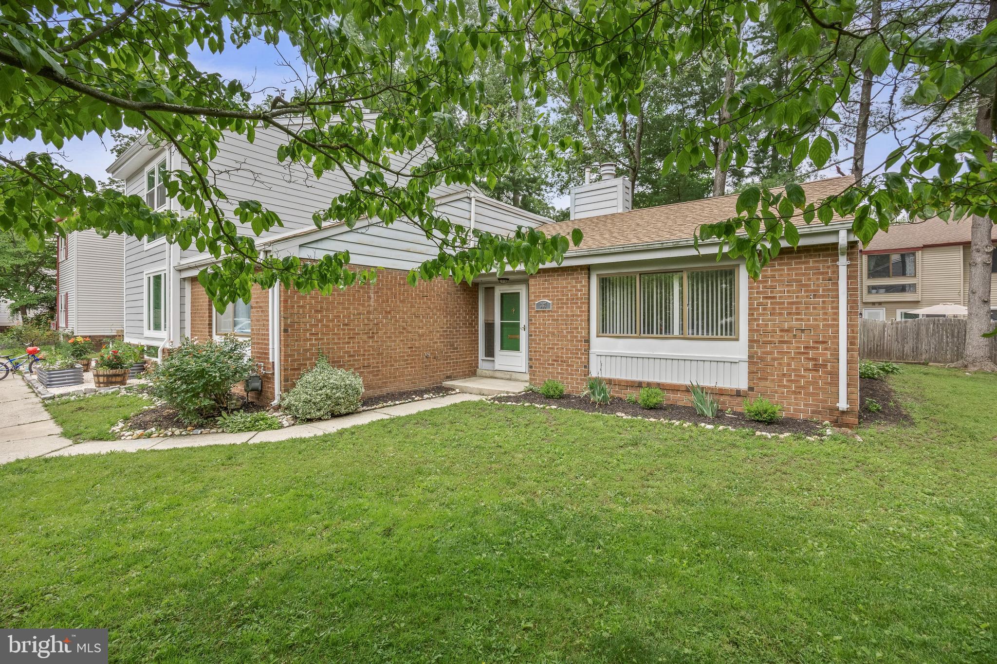 367 Barton Run Boulevard Marlton, NJ 08053 - Photo 2 of 24 a backyard of a house with plants and large tree