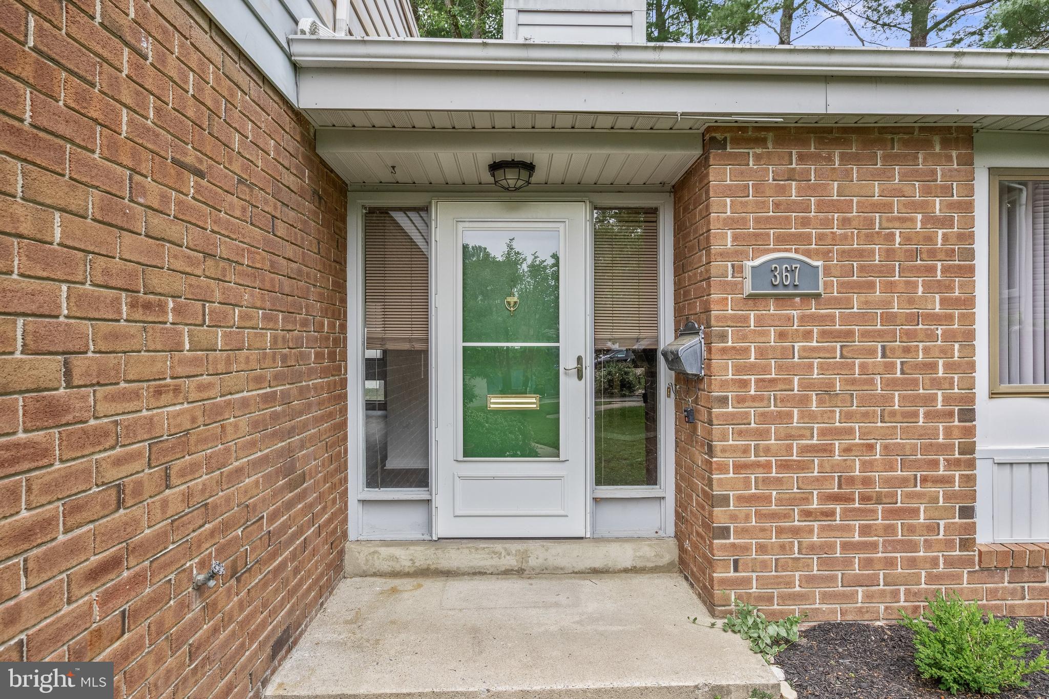 367 Barton Run Boulevard Marlton, NJ 08053 - Photo 3 of 24 a front view of a house with a garden
