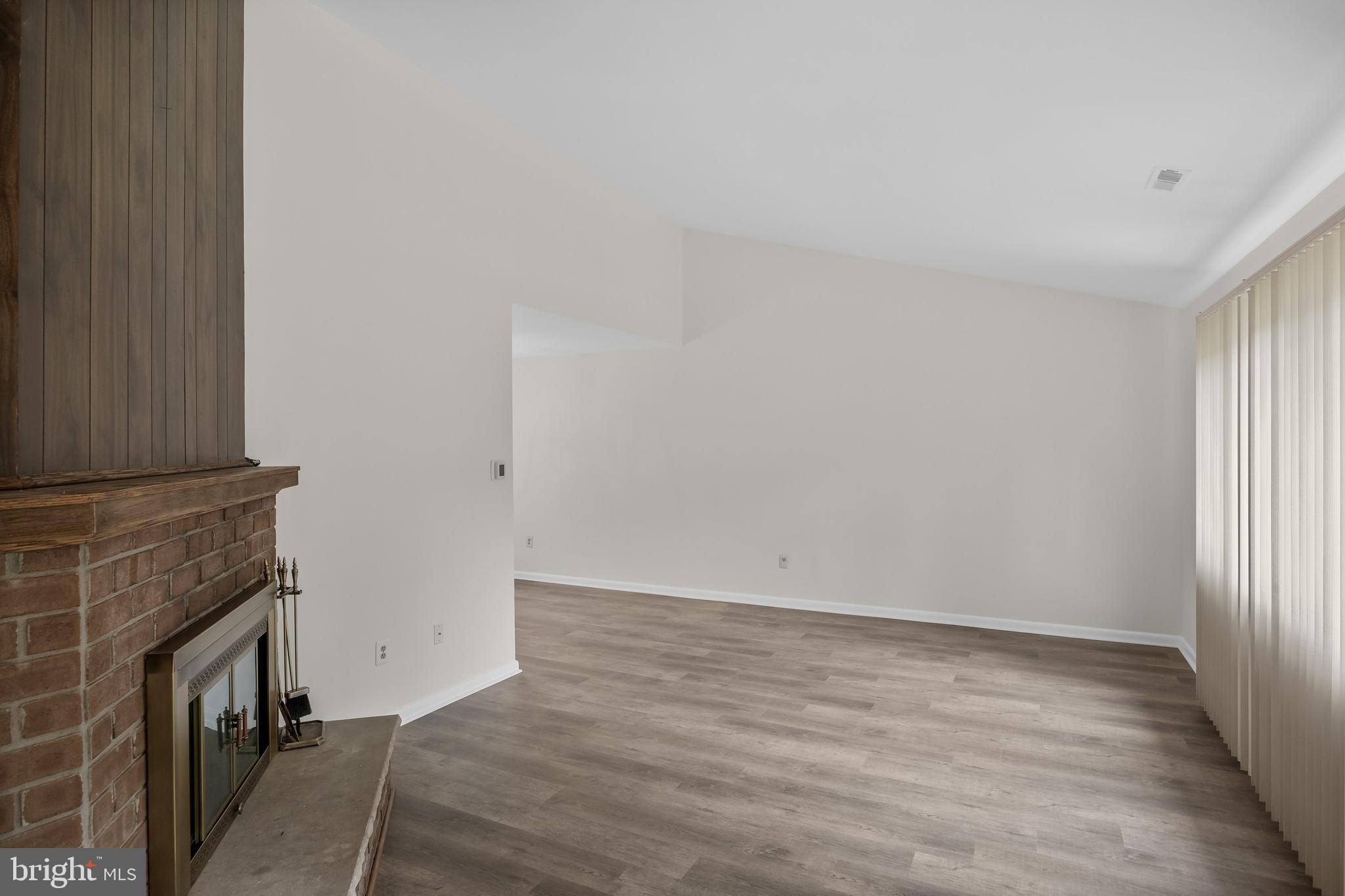 367 Barton Run Boulevard Marlton, NJ 08053 - Photo 5 of 24 a view of livingroom with hardwood floor and a fireplace