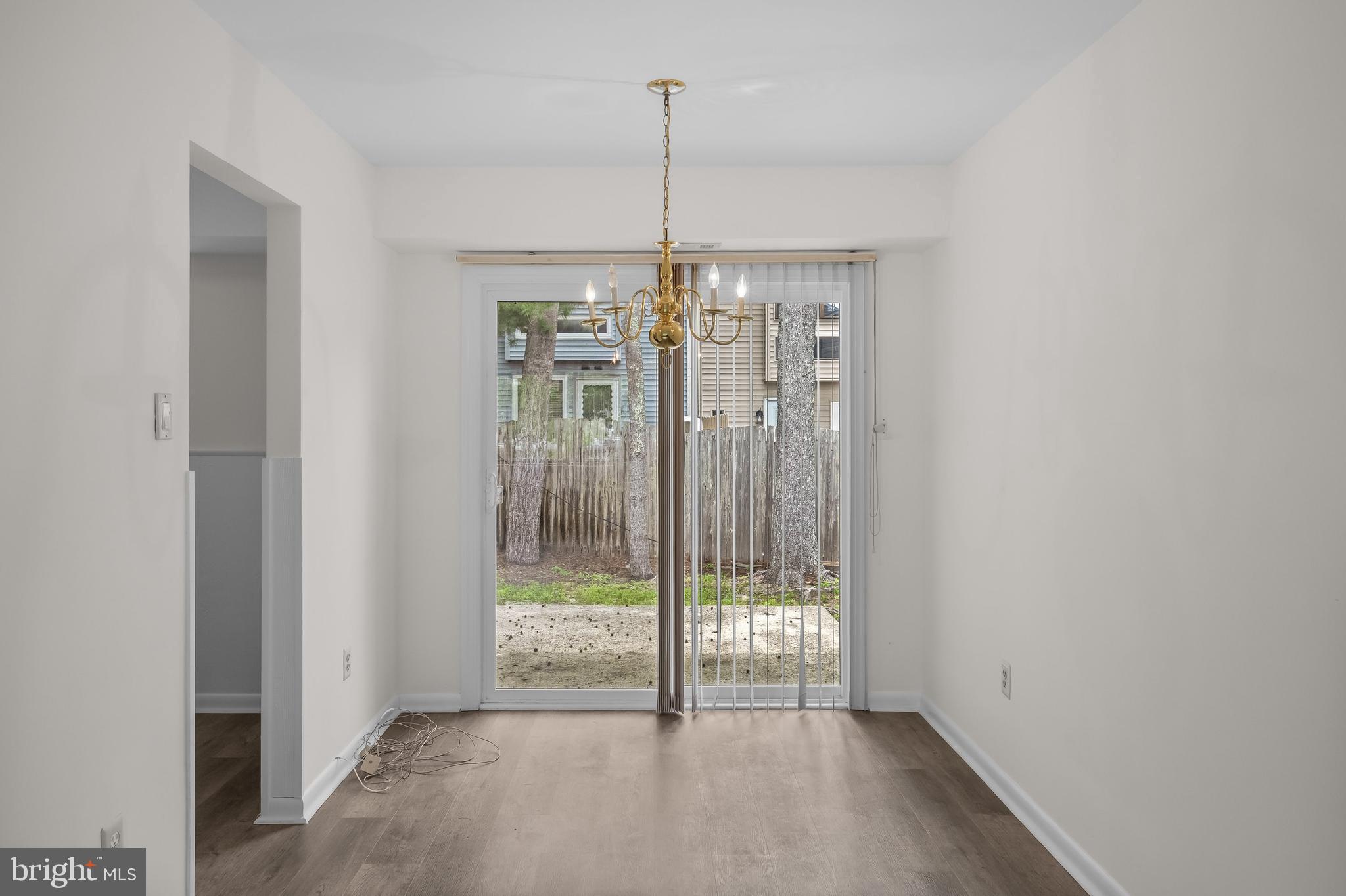 367 Barton Run Boulevard Marlton, NJ 08053 - Photo 9 of 24 a view of a room with window wooden floor and table