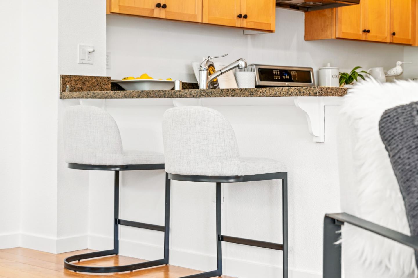 1909 Cambridge Drive Mountain View, CA 94043 - Photo 22 of 73 a kitchen with stainless steel appliances granite countertop a sink a stove and white cabinets