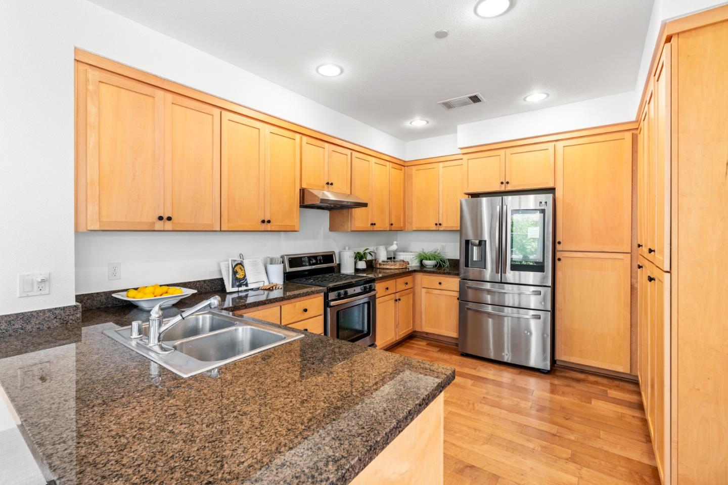 1909 Cambridge Drive Mountain View, CA 94043 - Photo 23 of 73 a kitchen with stainless steel appliances granite countertop a refrigerator a sink a stove and island