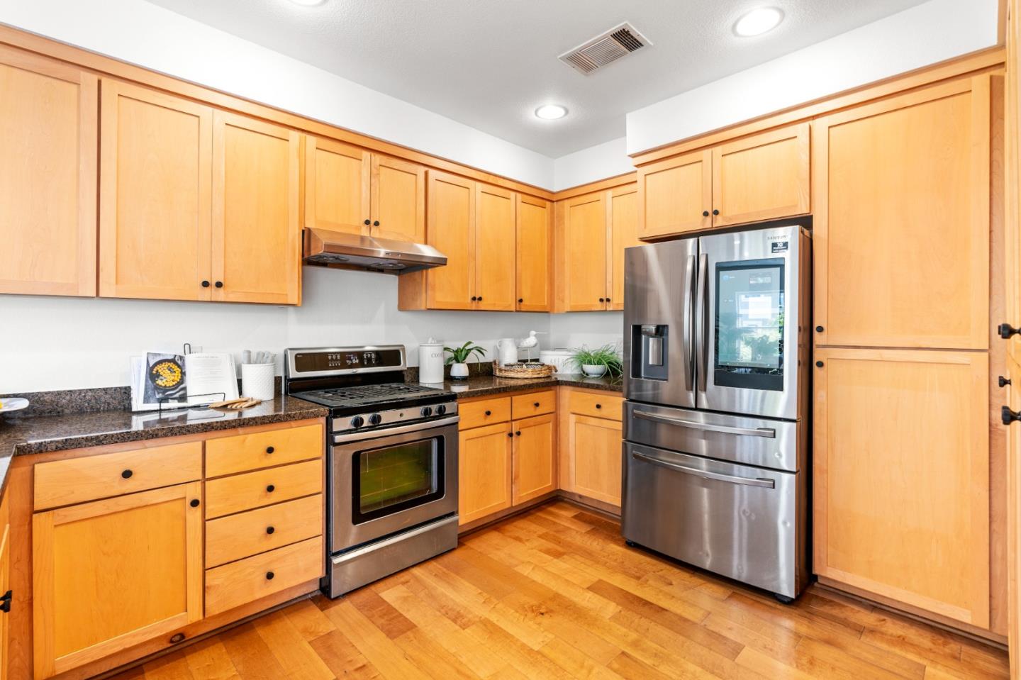 1909 Cambridge Drive Mountain View, CA 94043 - Photo 25 of 73 a kitchen with stainless steel appliances granite countertop a refrigerator stove and sink