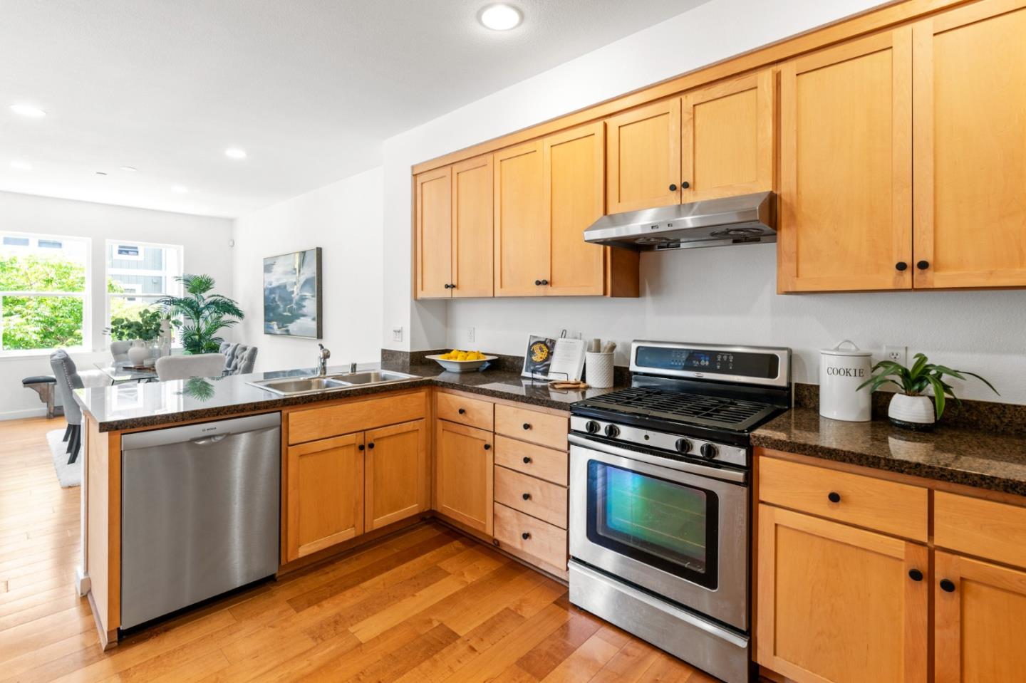 1909 Cambridge Drive Mountain View, CA 94043 - Photo 26 of 73 a kitchen with stainless steel appliances granite countertop a stove a sink and white cabinets
