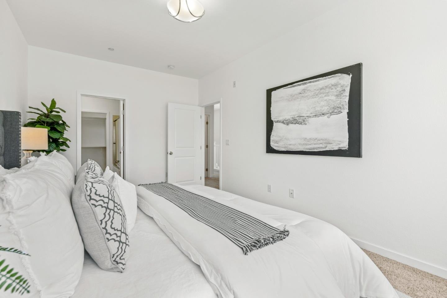 1909 Cambridge Drive Mountain View, CA 94043 - Photo 32 of 73 a bedroom with a large bed and a chandelier