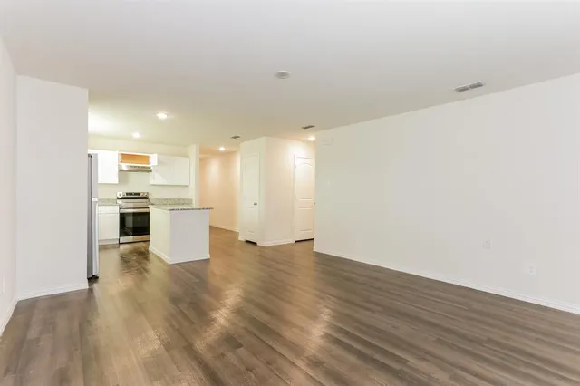 a view of kitchen with wooden floor