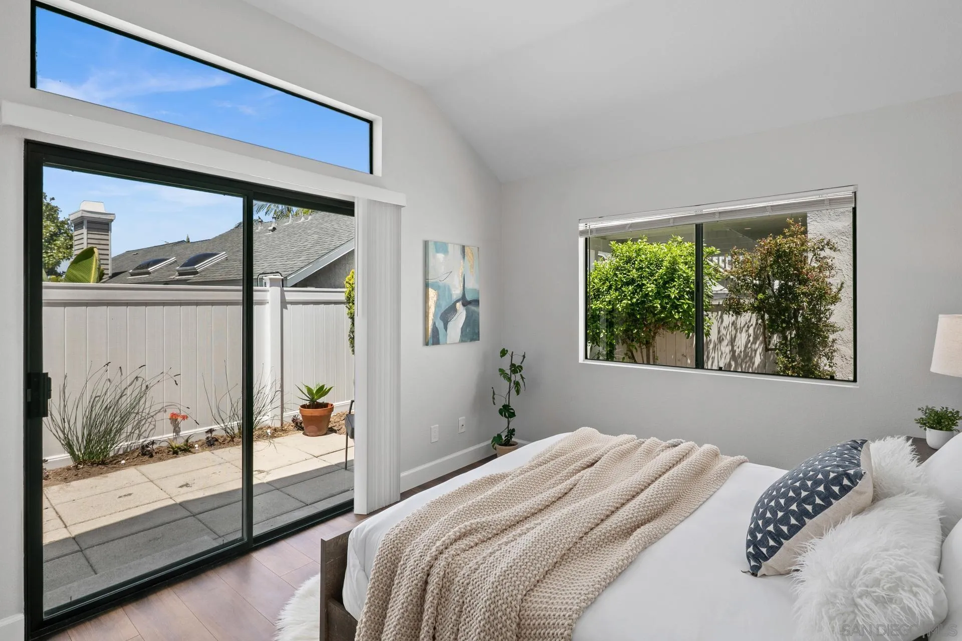 802 Spindrift Lane Carlsbad, CA 92011 - Photo 12 of 31 a bedroom with a large bed and a window