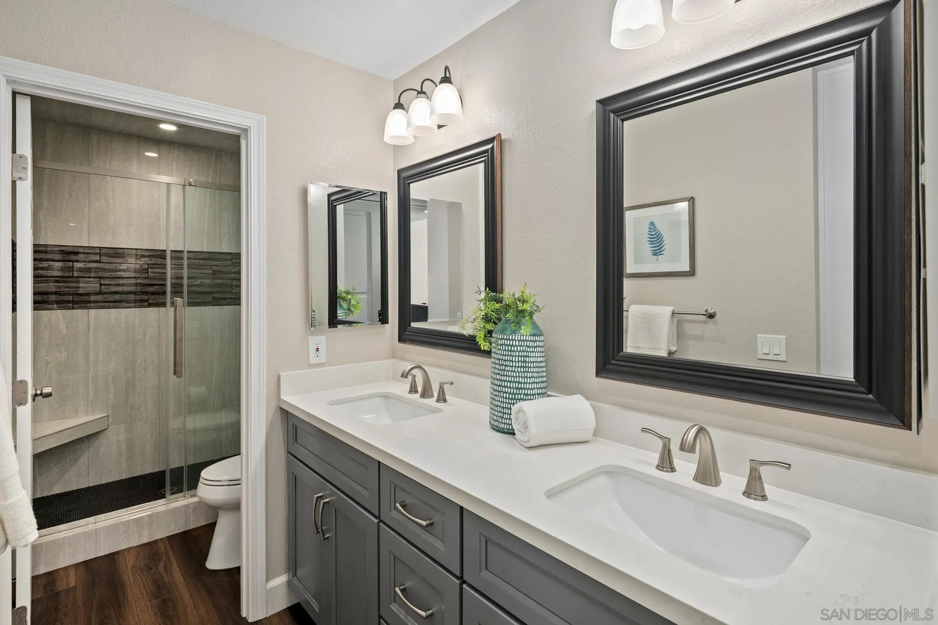 802 Spindrift Lane Carlsbad, CA 92011 - Photo 13 of 31 a bathroom with 2 sink and a mirror