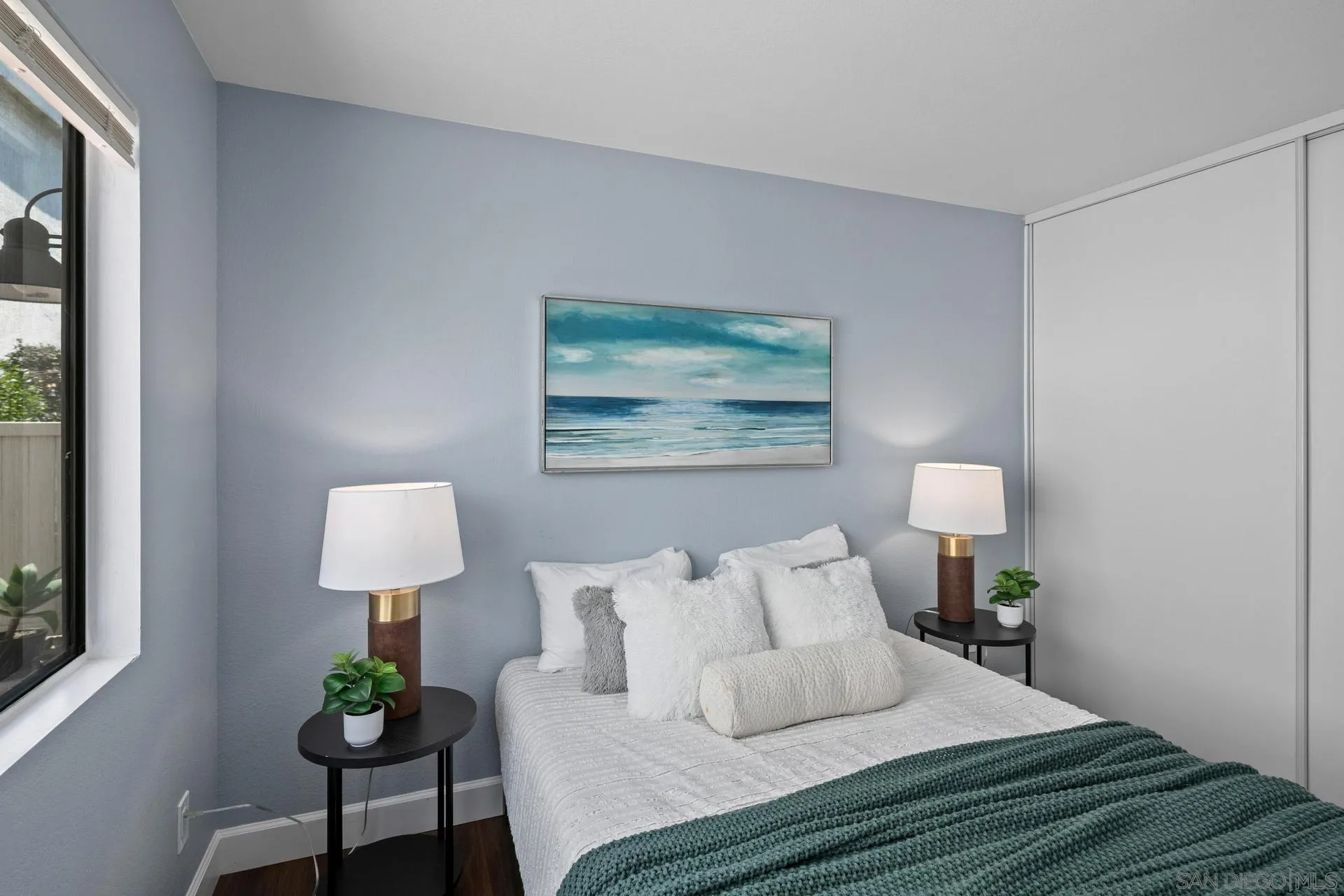 802 Spindrift Lane Carlsbad, CA 92011 - Photo 16 of 31 a bedroom with bed and a lamp on table