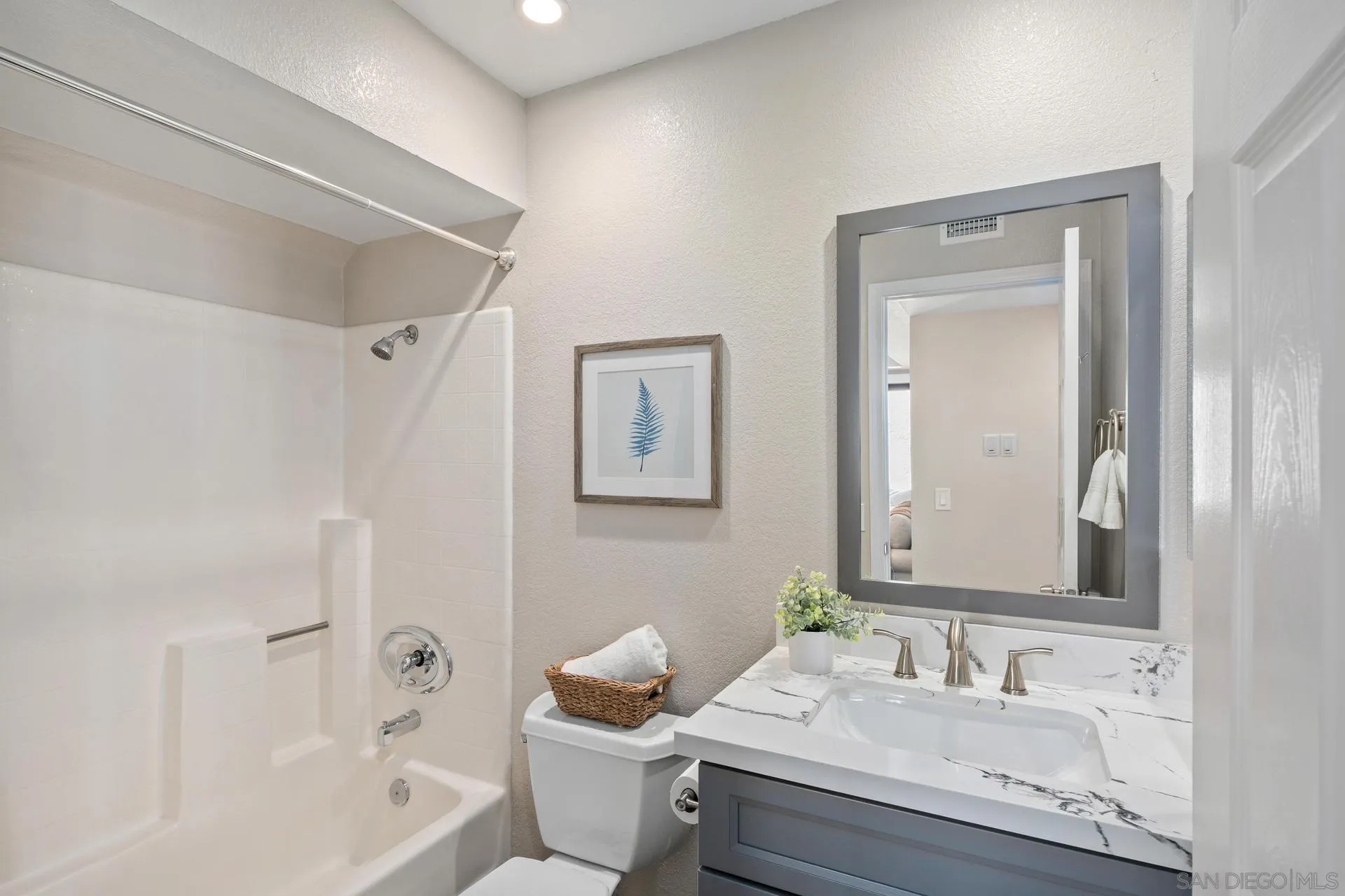 802 Spindrift Lane Carlsbad, CA 92011 - Photo 17 of 31 a bathroom with a granite countertop sink a toilet and shower