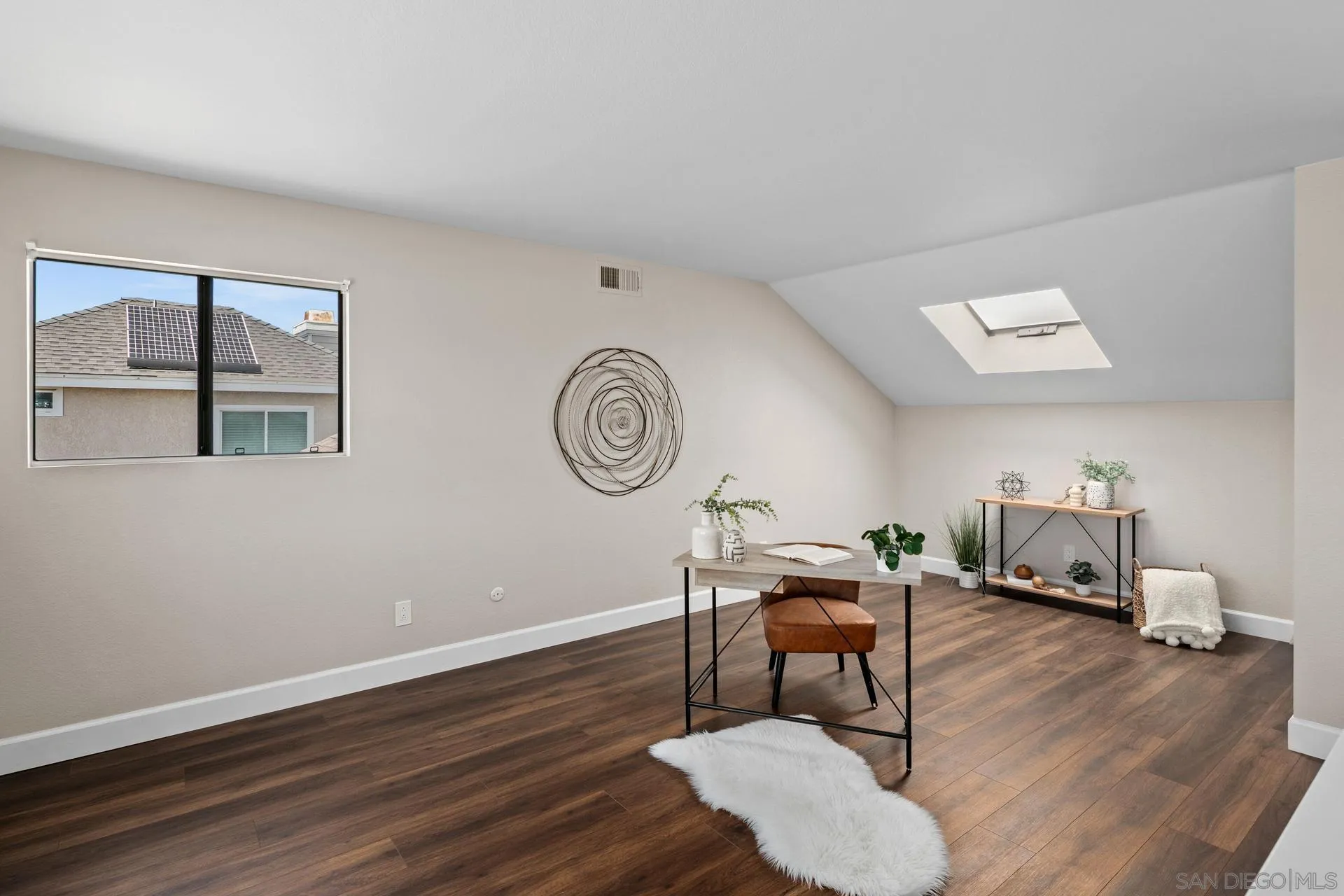 802 Spindrift Lane Carlsbad, CA 92011 - Photo 18 of 31 a living room with furniture and a wooden floor
