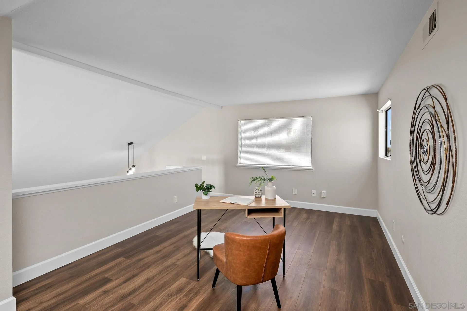 802 Spindrift Lane Carlsbad, CA 92011 - Photo 20 of 31 a workspace with furniture window and wooden floor