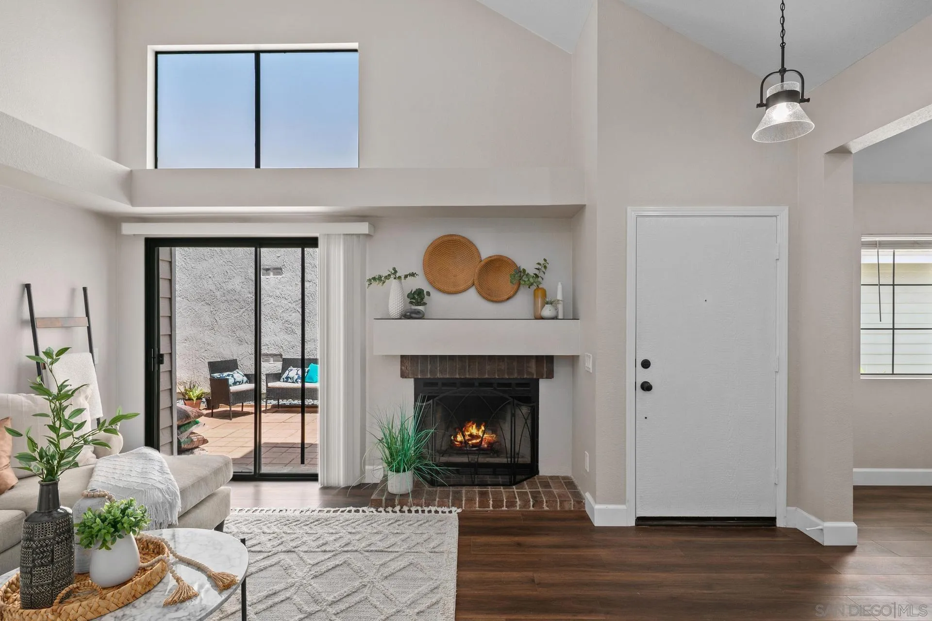 802 Spindrift Lane Carlsbad, CA 92011 - Photo 2 of 31 a living room with furniture and a fireplace