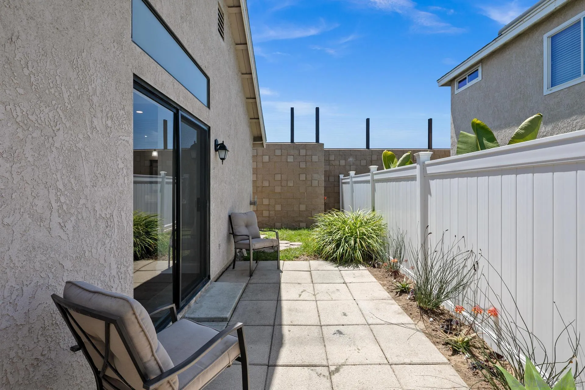 802 Spindrift Lane Carlsbad, CA 92011 - Photo 26 of 31 a view of a porch with chairs and potted plants