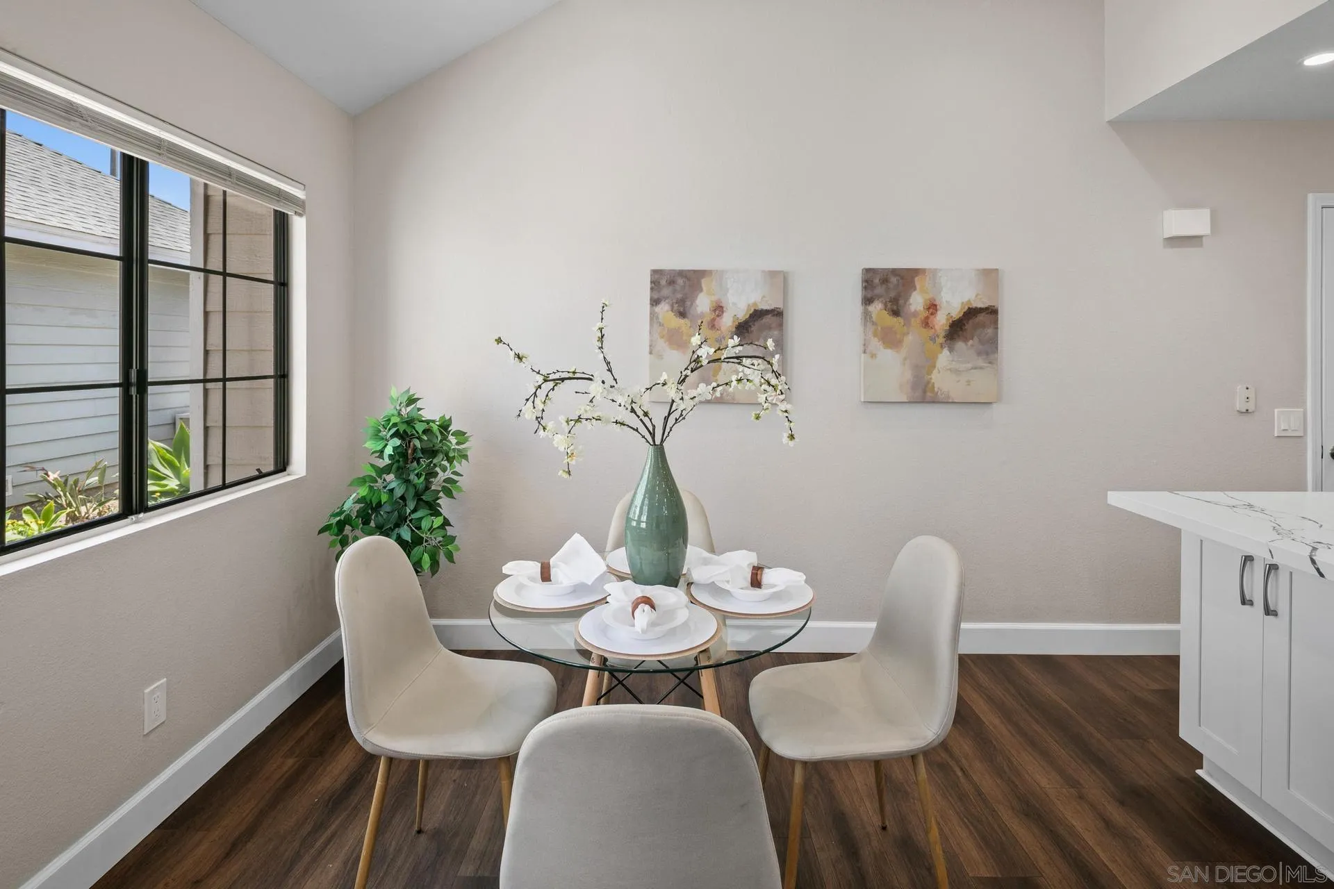 802 Spindrift Lane Carlsbad, CA 92011 - Photo 7 of 31 a view of a dining room with furniture window and wooden floor