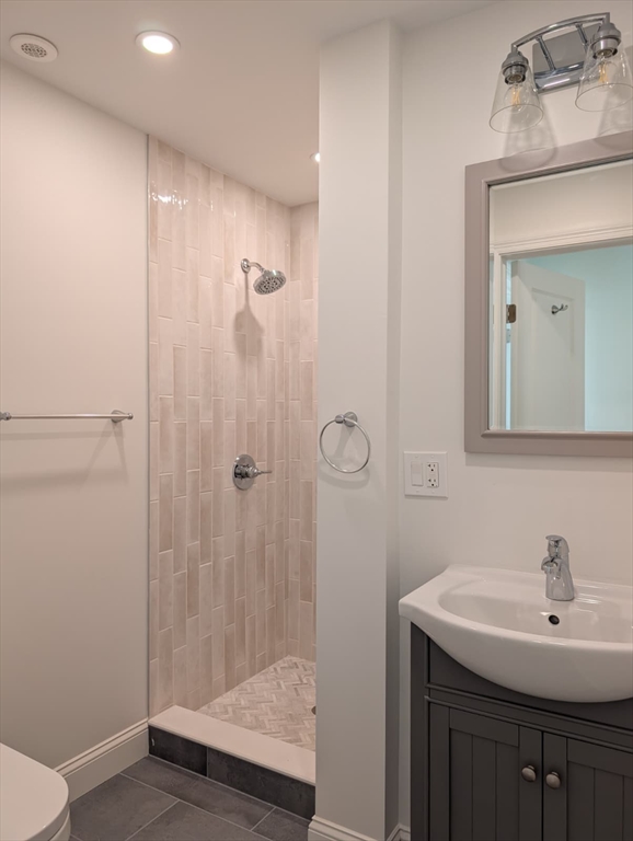 38 Regent Street, Unit 2 Boston, MA 02119 - Photo 13 of 14 a bathroom with a sink a toilet and shower