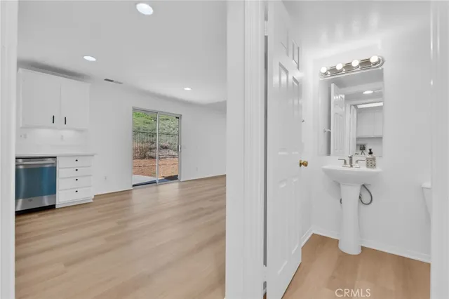a view of a kitchen cabinets and wooden floor