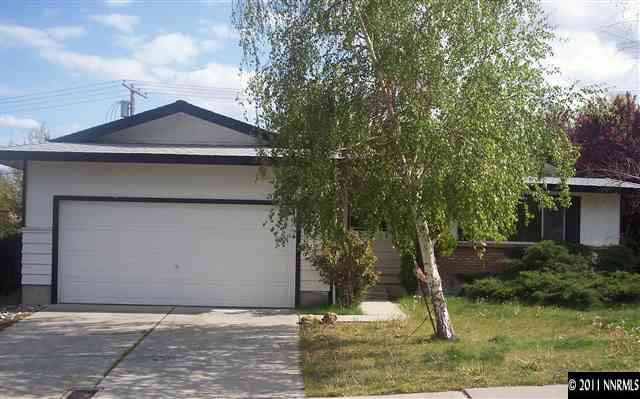 1910 Prince Way Reno, NV 89503 - Photo 1 of 13 a front view of a house with a yard