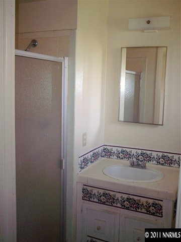 1910 Prince Way Reno, NV 89503 - Photo 6 of 13 a bathroom with a mirror and a shower