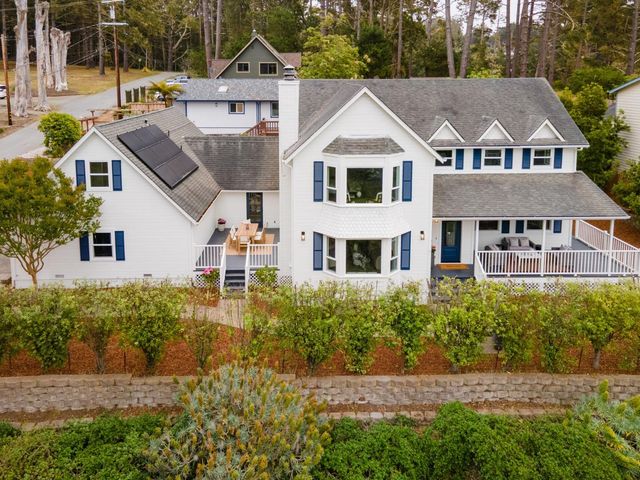 a aerial view of a house with a yard