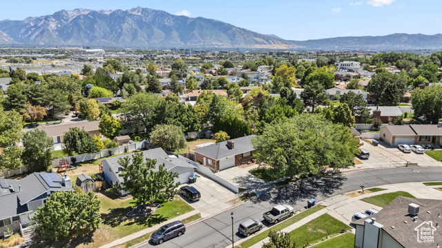 8843 Capernaum Road West Jordan, UT 84088 - Photo 28 of 31 Aerial perspective of suburban area featuring a mountainous background