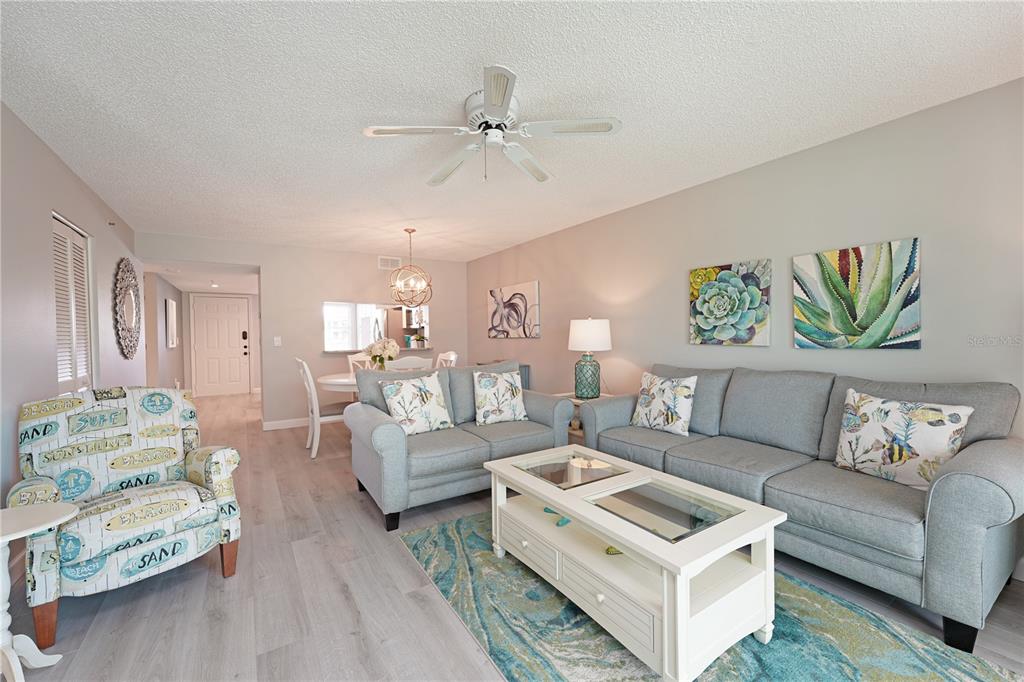 6501 Stone River Road, Unit 205 Bradenton, FL 34203 - Photo 11 of 50 a living room with furniture and a wooden floor