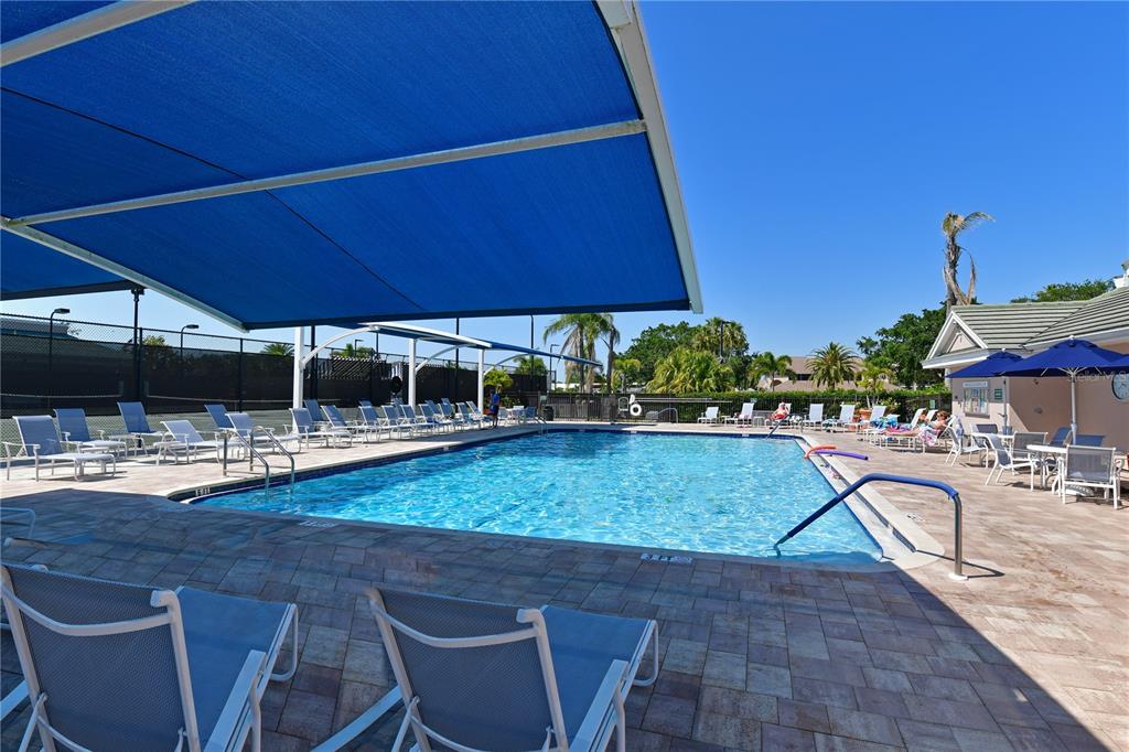 6501 Stone River Road, Unit 205 Bradenton, FL 34203 - Photo 31 of 50 a patio with table and chairs