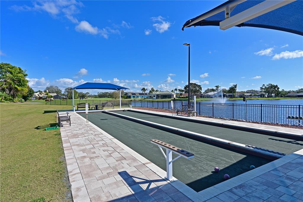 6501 Stone River Road, Unit 205 Bradenton, FL 34203 - Photo 34 of 50 a view of a swimming pool with a deck and a backyard
