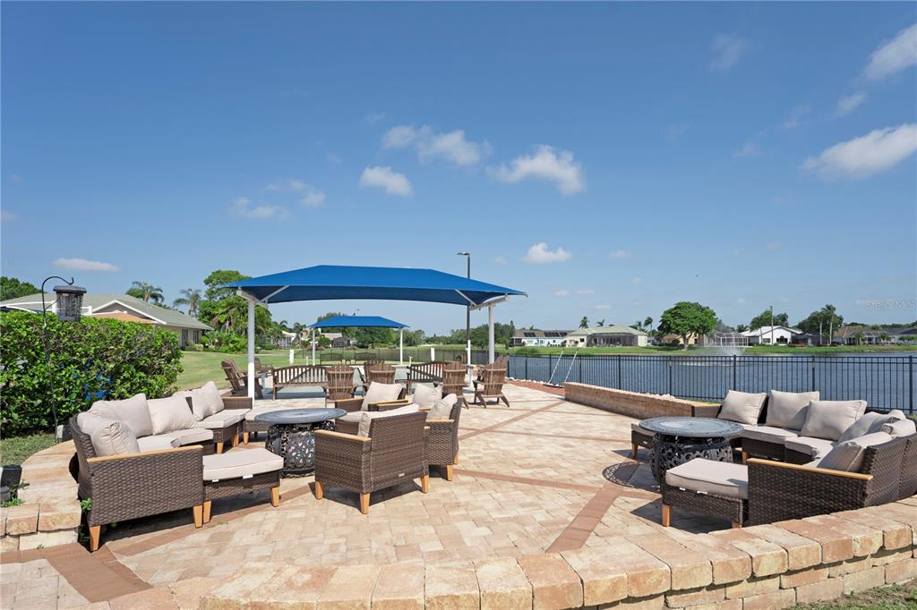6501 Stone River Road, Unit 205 Bradenton, FL 34203 - Photo 39 of 50 a view of a patio with couches and pool