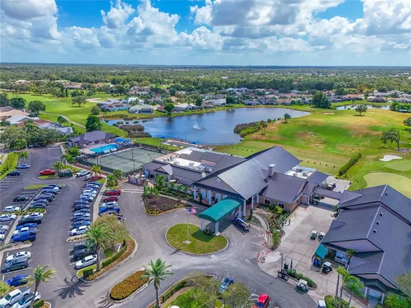 an aerial view of a house with outdoor space swimming pool and ocean view