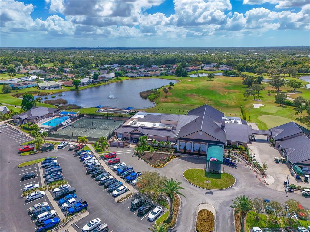 6501 Stone River Road, Unit 205 Bradenton, FL 34203 - Photo 42 of 50 an aerial view of a house with outdoor space swimming pool and ocean view