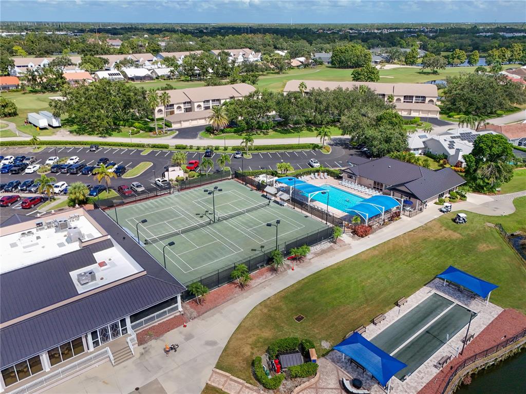 6501 Stone River Road, Unit 205 Bradenton, FL 34203 - Photo 45 of 50 an aerial view of a pool a yard patio swimming pool and outdoor seating