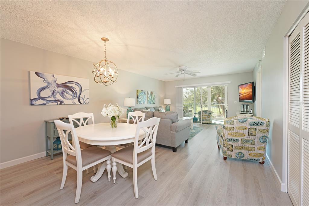 6501 Stone River Road, Unit 205 Bradenton, FL 34203 - Photo 10 of 50 a view of a dining room with furniture window and outside view