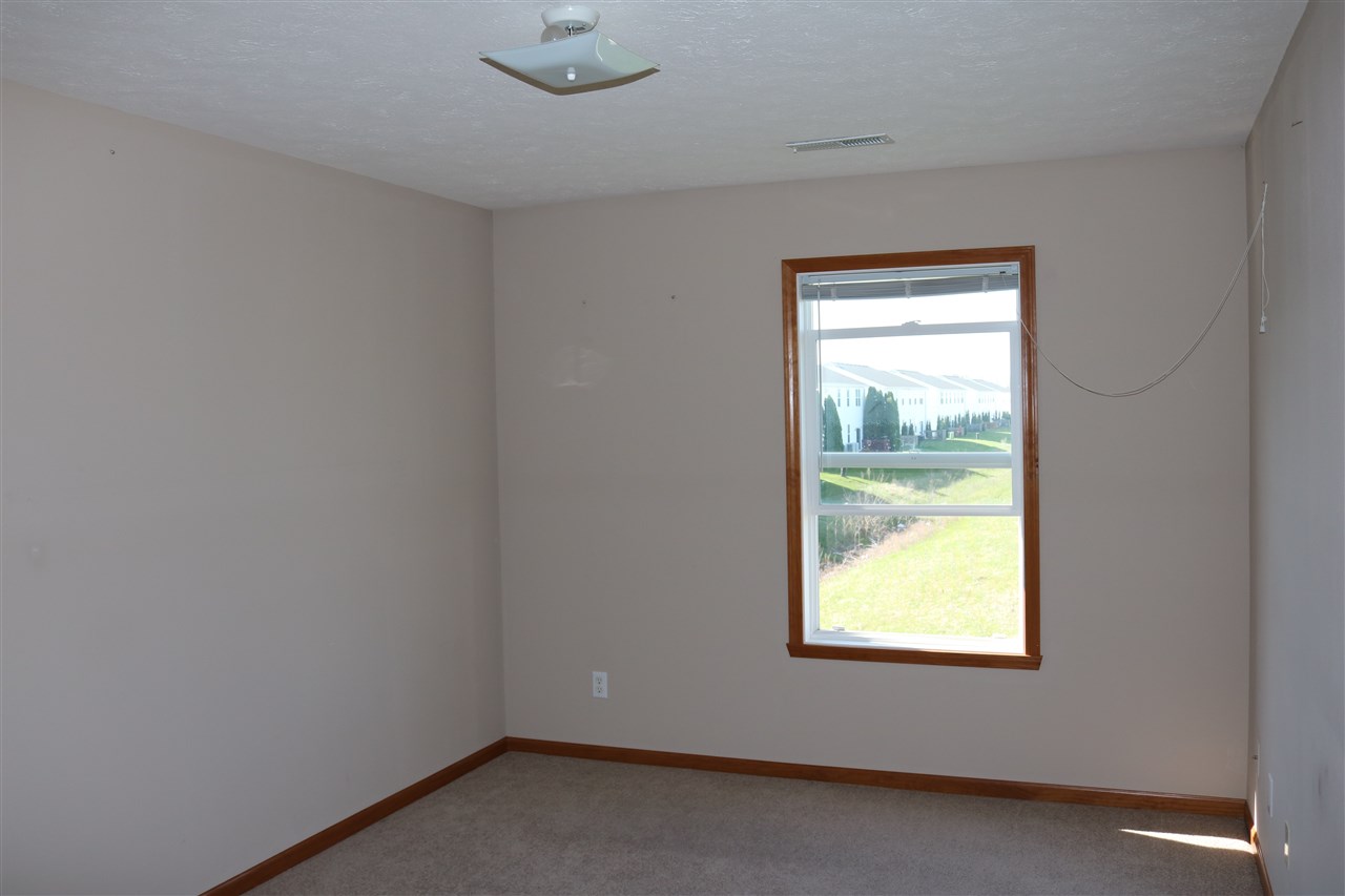 410 Pine White Road, Unit 1 Roscoe, IL 61073 - Photo 12 of 13 an empty room with a window
