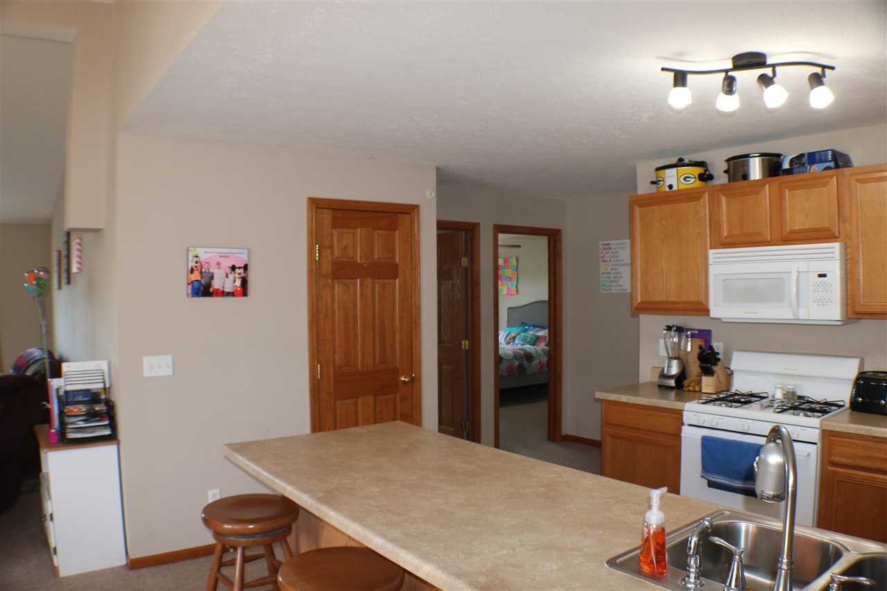 410 Pine White Road, Unit 1 Roscoe, IL 61073 - Photo 7 of 13 a workspace with furniture and window