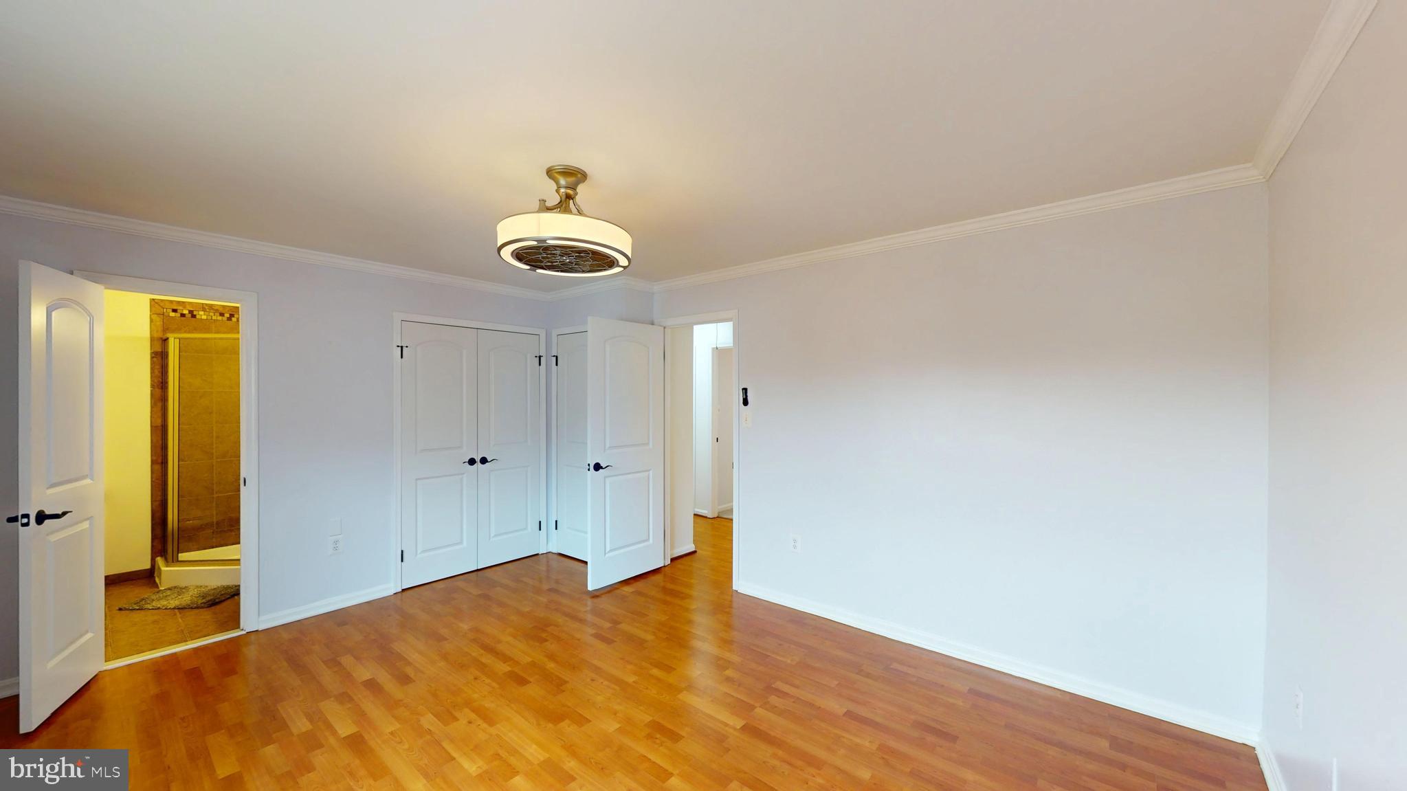 8576 Adamson Street Manassas, VA 20110 - Photo 15 of 25 a bedroom with a bed and a window