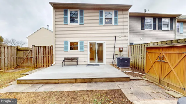 a view of a house with wooden floor roof and furniture