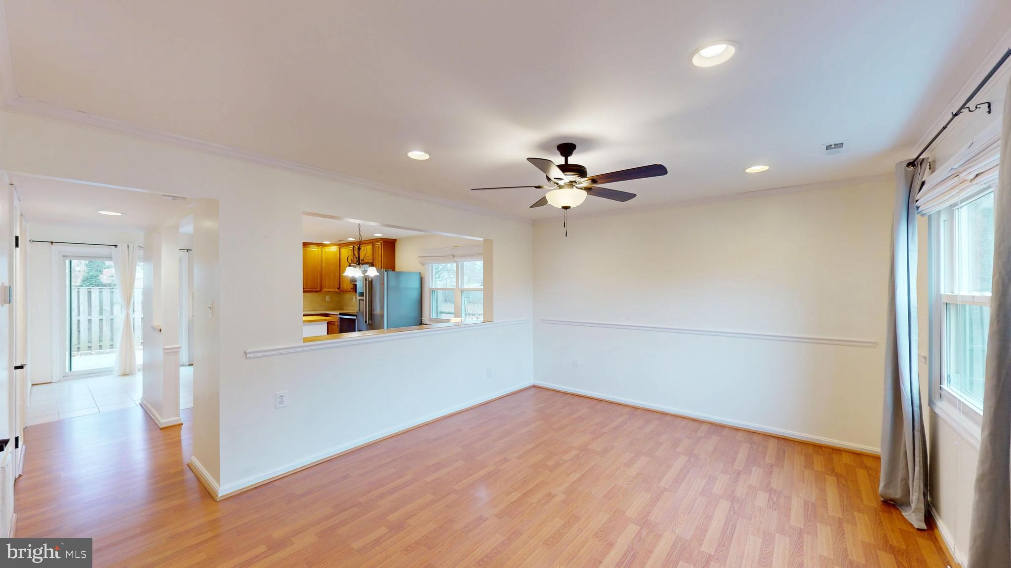 8576 Adamson Street Manassas, VA 20110 - Photo 4 of 25 a view of empty room with wooden floor