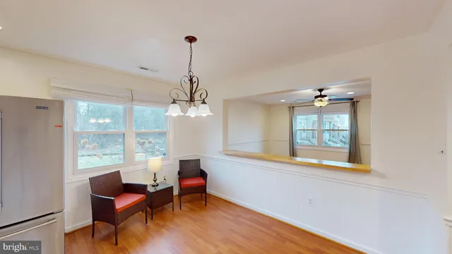 a view of a livingroom with furniture window and wooden floor