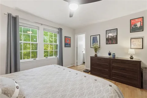 a bed room with a bed and a television