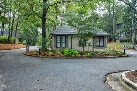 front view of a house with porch and a yard